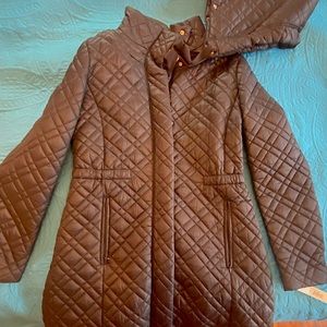 NWT Tahari quilted black jacket. Gold trim. Cinched in waist. Detachable hood.